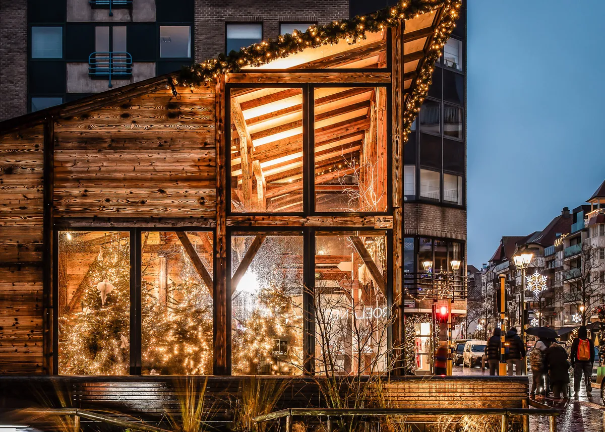 Christmas market with Winterbarn structure and festive lights