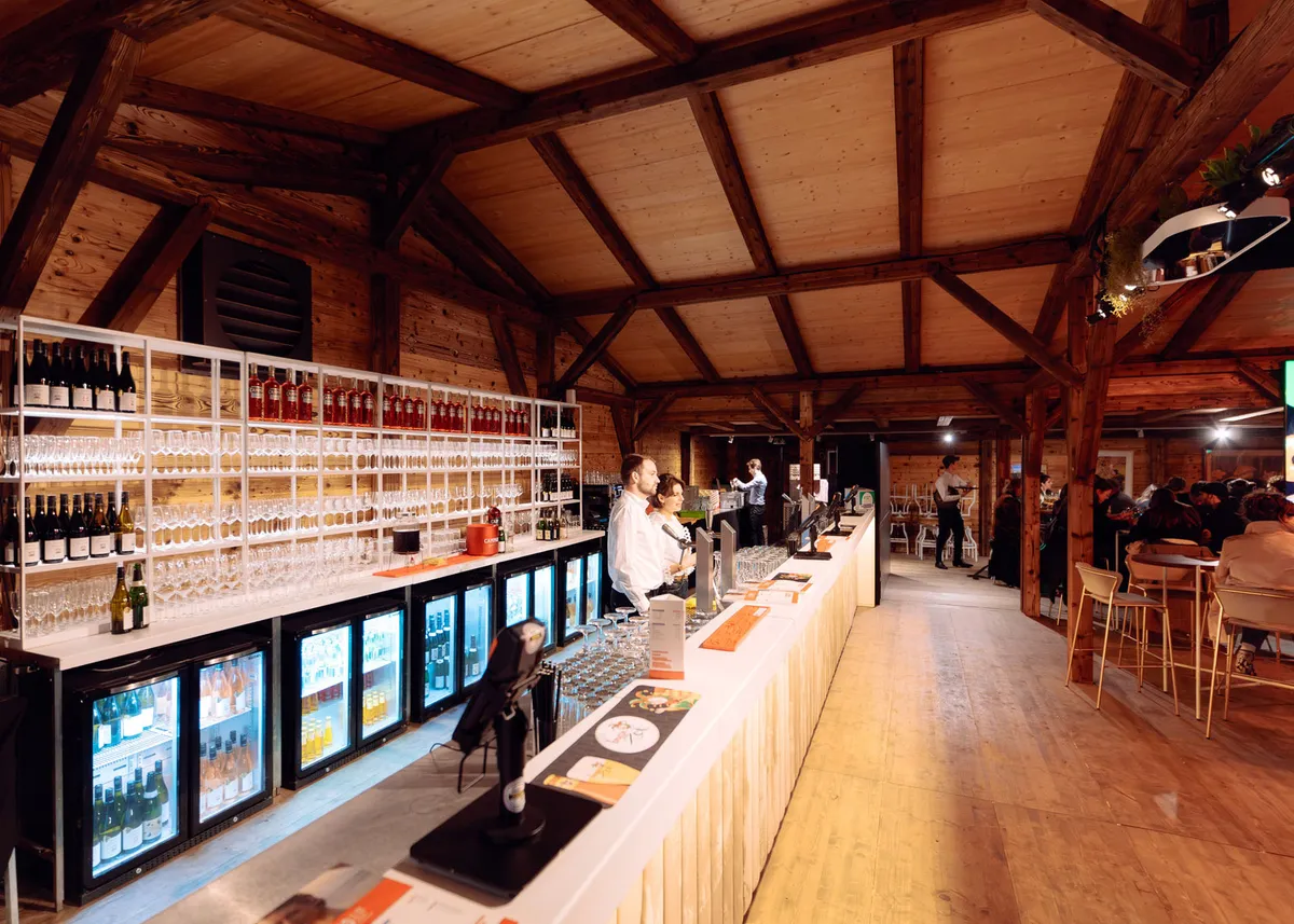 Birthday party in decorated Modubarn structure with string lights