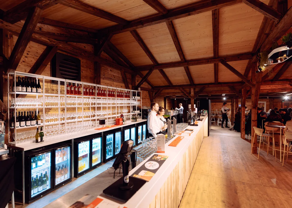 Rustic wooden bar at an outdoor event