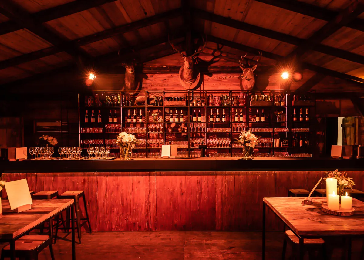 Bar structure with overhead canopy at an outdoor event