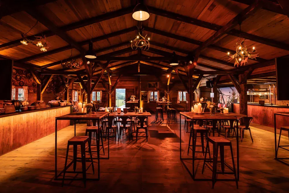 Interior of a luxury glamping lounge with comfortable seating and ambient lighting