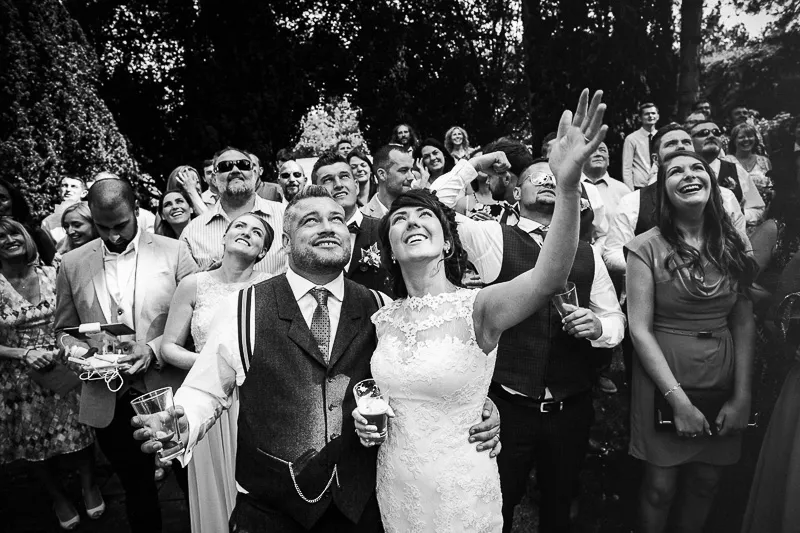 Groomsmen gathered together in a relaxed rustic wedding setting