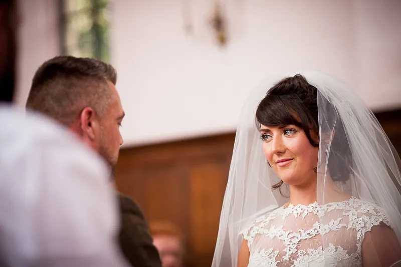 Rustic wedding scene showing guests enjoying the outdoor setting