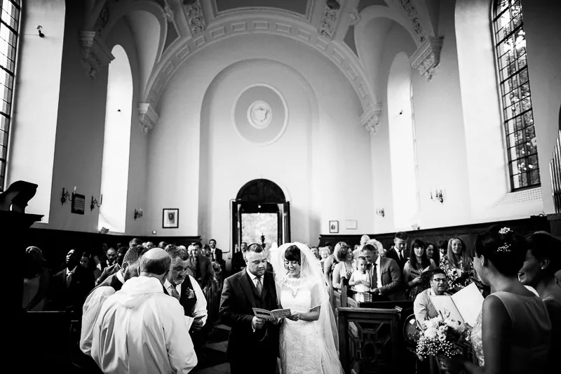 Wedding guests and venue details captured within the woodland marquee setting